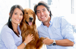 bigstock-Happy-couple-holding-their-dog-44365765OPT